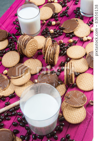 breakfast with chocolate cookies and a glass of milk breakfast with chocolate cookies and a glass of milk 83650138