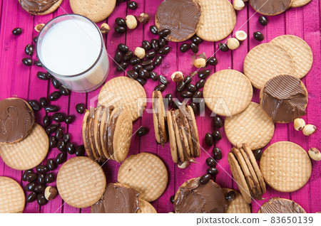 breakfast with chocolate cookies and a glass of milk breakfast with chocolate cookies and a glass of milk 83650139