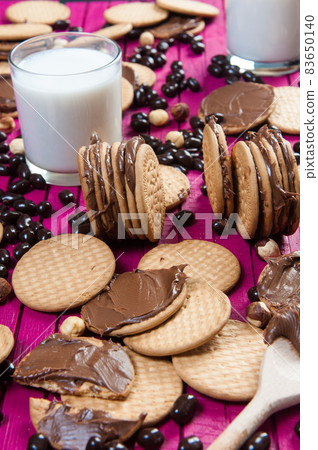 breakfast with chocolate cookies and a glass of milk 83650140