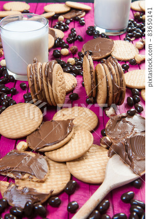 breakfast with chocolate cookies and a glass of milk breakfast with chocolate cookies and a glass of milk 83650141