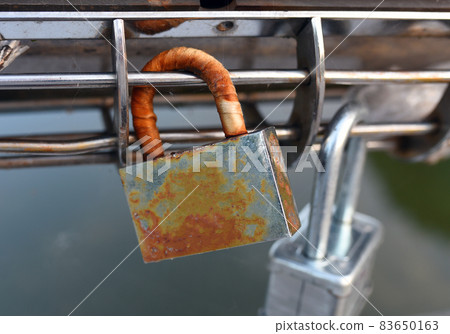 Padlock on Lovers Lock Bridge. Padlock on Lovers Lock Bridge. 83650163
