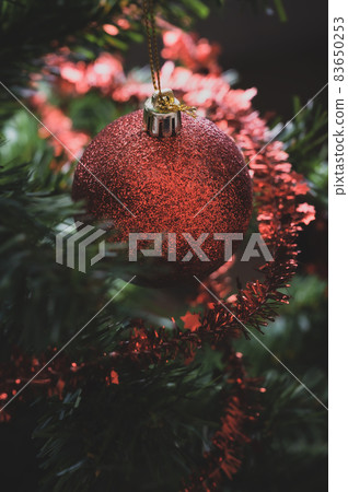Closeup of shiny red holiday bauble Closeup of shiny red holiday bauble 83650253