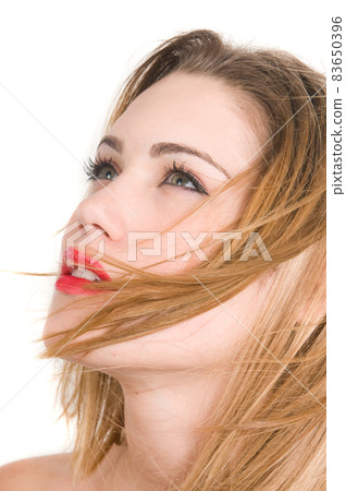 close-up portrait of attractive blonde woman with a sensual look close-up portrait of attractive blonde woman with a sensual look 83650396