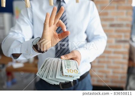 Man in suit with cash Man in suit with cash 83650811