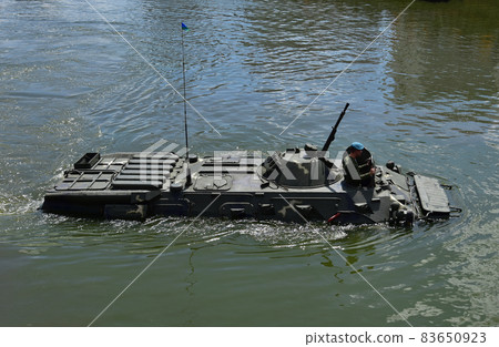 Sailing on BTR APC Amphibious Armoured Personnel Carrier. Armed forces on military exercises  83650923