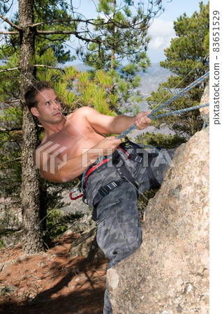 climber man on top of a mountain climber man on top of a mountain 83651529