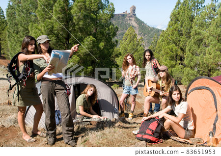 group of female hikers in their huts among the pines group of female hikers in their huts among the pines 83651953
