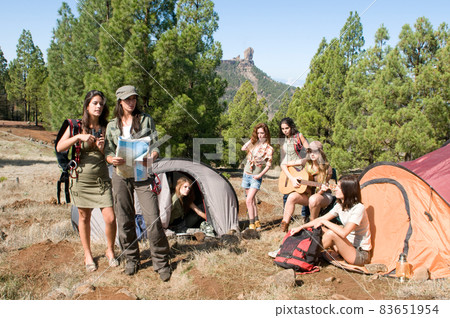 group of female hikers in their huts among the pines 83651954