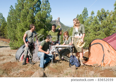 group of hikers in their huts among the pines. group of hikers in their huts among the pines. 83652039