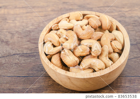 Tasty cashew nuts in bowl. Tasty cashew nuts in bowl. 83653538