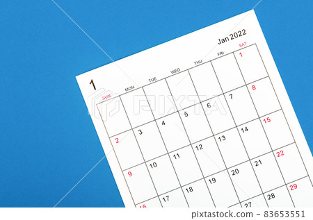 January 2022 calendar sheet on blue background. January 2022 calendar sheet on blue background. 83653551