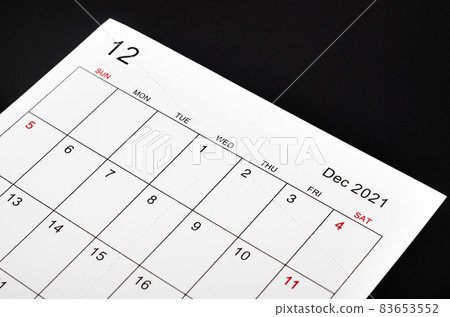 December 2021 calendar sheet on black background. December 2021 calendar sheet on black background. 83653552