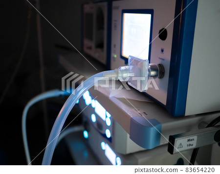 Selective focus on the transparent insufflator hose in the operating room. 83654220