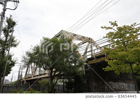 A railway bridge on the Etchujima branch of the Sobu Main Line that crosses the Onagi River A railway bridge on the Etchujima branch of the Sobu Main Line that crosses the Onagi River 83654445