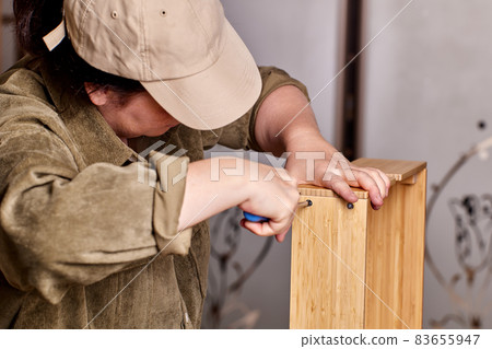 Furniture from flat pack is assembled at home. 83655947