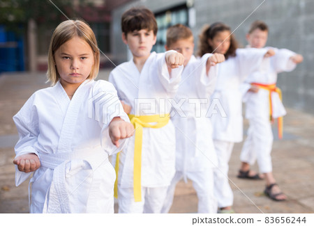 Kids in kimono doing kata moves Kids in kimono doing kata moves 83656244