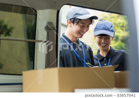 Delivery driver choosing luggage Delivery driver choosing luggage 83657041