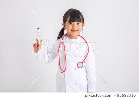 Girl in a lab coat Girl in a lab coat on a white background Child with an injection Girl in a lab coat Girl in a lab coat on a white background Child with an injection 83658310