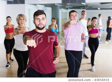 adults of different ages dancing at dance class 83658433