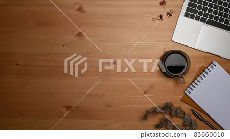 Computer laptop, notepad and coffee cup on wooden background. Computer laptop, notepad and coffee cup on wooden background. 83660010