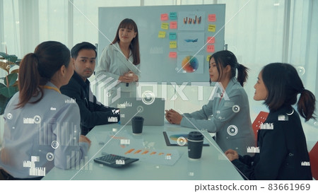 Business people in corporate staff meeting with envisional graphic Business people in corporate staff meeting with envisional graphic 83661969