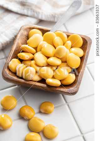 Pickled yellow Lupin Beans in bowl 83663837