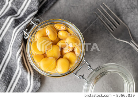 Pickled yellow Lupin Beans in jar. 83663839
