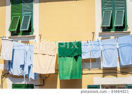 Towels Hanging out to dry on a Clothesline in Liguria Italy Towels Hanging out to dry on a Clothesline in Liguria Italy 83664821