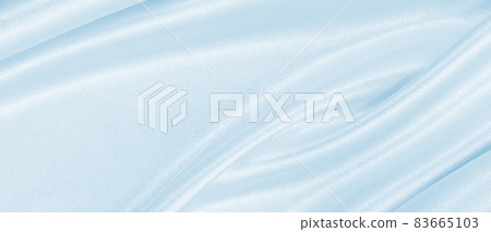 Smooth elegant blue silk or satin luxury cloth texture as abstract background. Luxurious background design Smooth elegant blue silk or satin luxury cloth texture as abstract background. Luxurious background design 83665103
