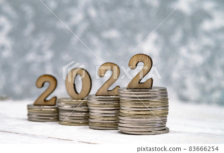 Banner 2022. Coins and Figures 2022. Money stacked in columns. Banner 2022. Coins and Figures 2022. Money stacked in columns. 83666254