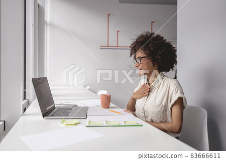 Happy multiethnic woman talking and showing sign language Happy multiethnic woman talking and showing sign language 83666611