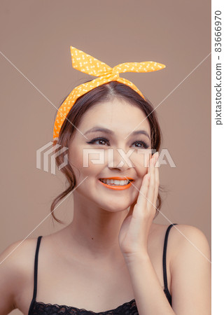 Portrait of lovely beautiful young woman tenderly flirting smiling, hand palm near the cheek isolated over pink background Portrait of lovely beautiful young woman tenderly flirting smiling, hand palm near the cheek isolated over pink background 83666970
