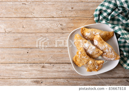 Spanish sweet stuffed pastry filled with angel hair 83667818