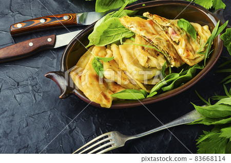 Tasty Azerbaijani qutab with young greens Tasty Azerbaijani qutab with young greens 83668114