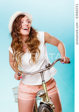 Active woman riding bike bicycle. Recreation. 83668351