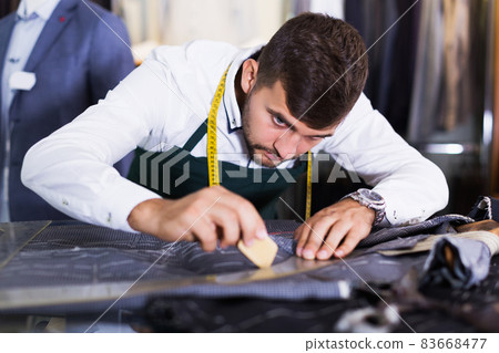 guy snipper in modern workshop 83668477