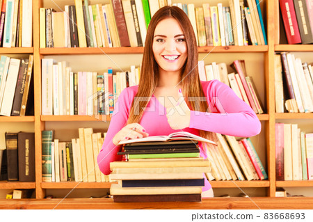 Content girl student in college library Content girl student in college library 83668693