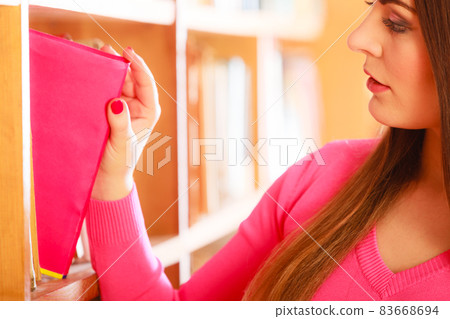 Girl student in college library Girl student in college library 83668694
