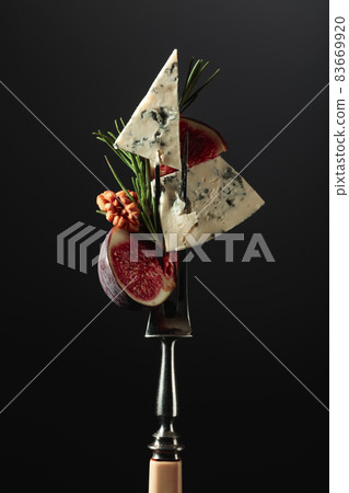 Blue cheese with figs, walnuts, and rosemary. Blue cheese with figs, walnuts, and rosemary. 83669920