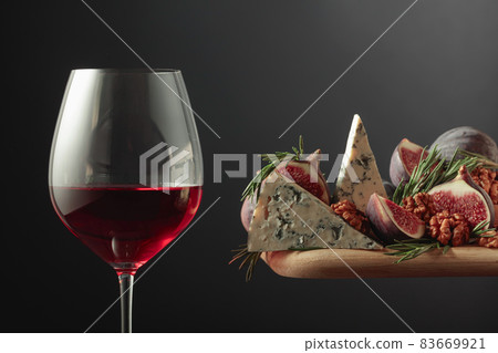 Red wine with blue cheese, figs, walnuts, and rosemary. Red wine with blue cheese, figs, walnuts, and rosemary. 83669921