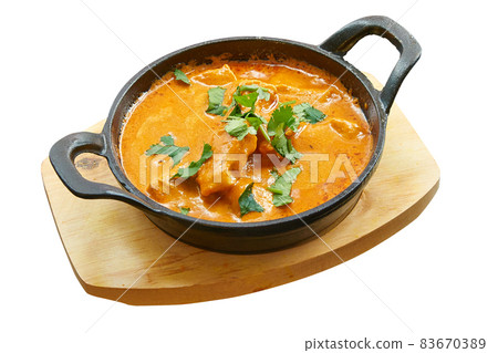 Overhead shot of Chicken butter baked in little pan. Overhead shot of Chicken butter baked in little pan. 83670389