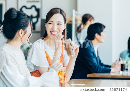 A young woman relaxing in a cafe A young woman relaxing in a cafe 83671174