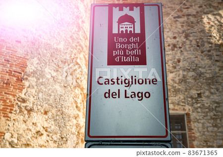 Castiglione del Lago Trasimeno, Umbria, Italy. August 2020. The plaque of recognition of the most beautiful villages in Italy. Castiglione del Lago Trasimeno, Umbria, Italy. August 2020. The plaque of recognition of the most beautiful villages in Italy. 83671365