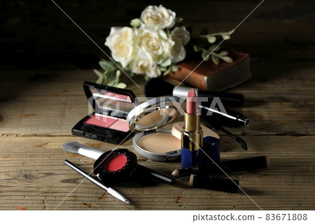 Blush, lipstick, eye color, foundation and brush. Marriage image with Bible and bouquet 83671808