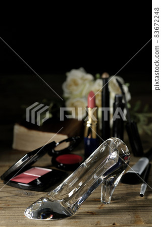 Glass shoes, lipstick, blush, mascara, brushes, bouquets, and the Bible. Marriage image. Cinderella. 83672248