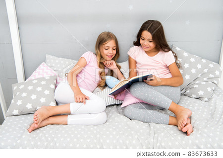 Stories every kid should read. Children read book in bed. Stories every kid should read. Children read book in bed. 83673633