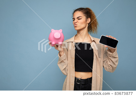 Portrait photo of dissatisfied doubtful young beautiful attractive brunette curly woman with sincere Portrait photo of dissatisfied doubtful young beautiful attractive brunette curly woman with sincere 83673877