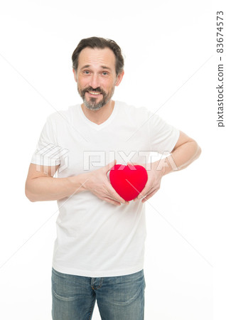 Preventing heart attack. Valentines man holding red toy 83674573