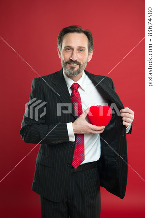 Gift from heart. Man mature handsome guy wear elegant Gift from heart. Man mature handsome guy wear elegant 83674580
