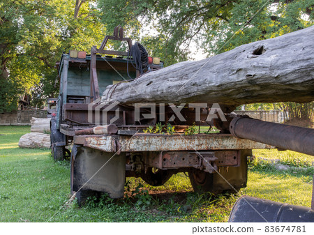 Old Logging truck with wooden logs. Old Logging truck with wooden logs. 83674781